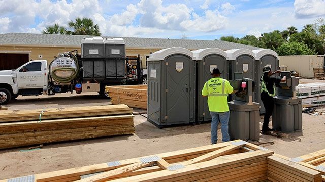 Luxe Flush porta potties and hand wash stations on an Seminole County construction site